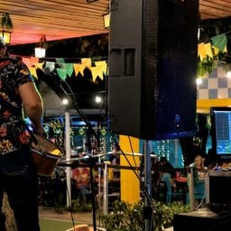 A musician playing live music on a stage.