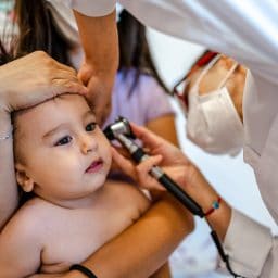 Close up of a pediatrician having a check up on her baby patient