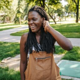 Happy woman in the park without allergies