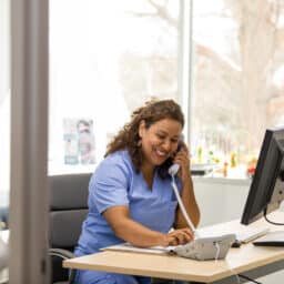Doctor makes patient calls in the office